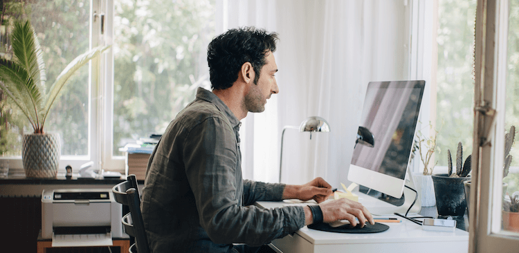 person working on a computer at home