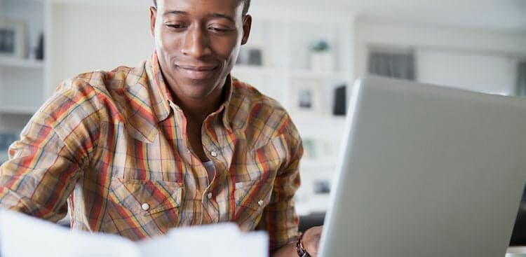 person on computer thinking